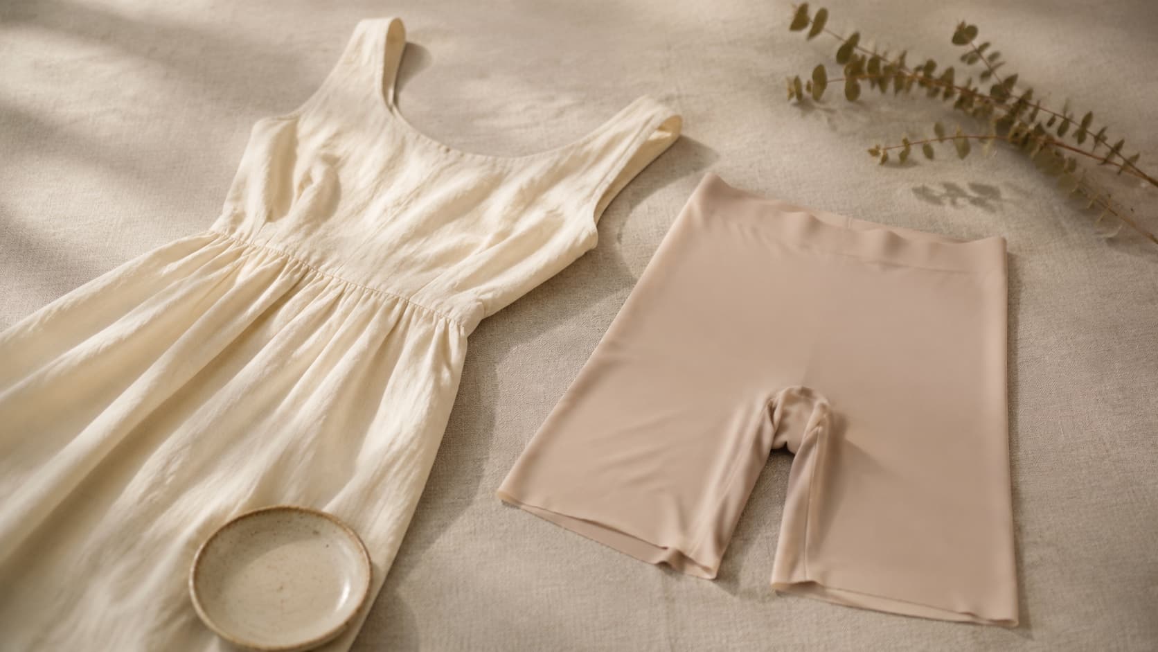 Mid-thigh safety shorts laid flat, the invisible layer worn under dresses